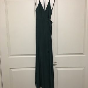 Emerald green slit maxi dress. Cross back.